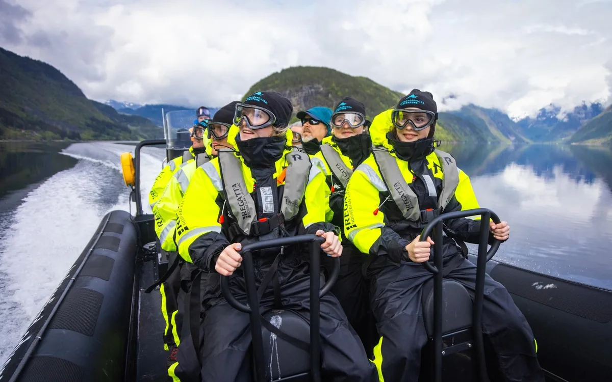 A group in survival suits on a RIB on the Hardangerfjord at Ulvik